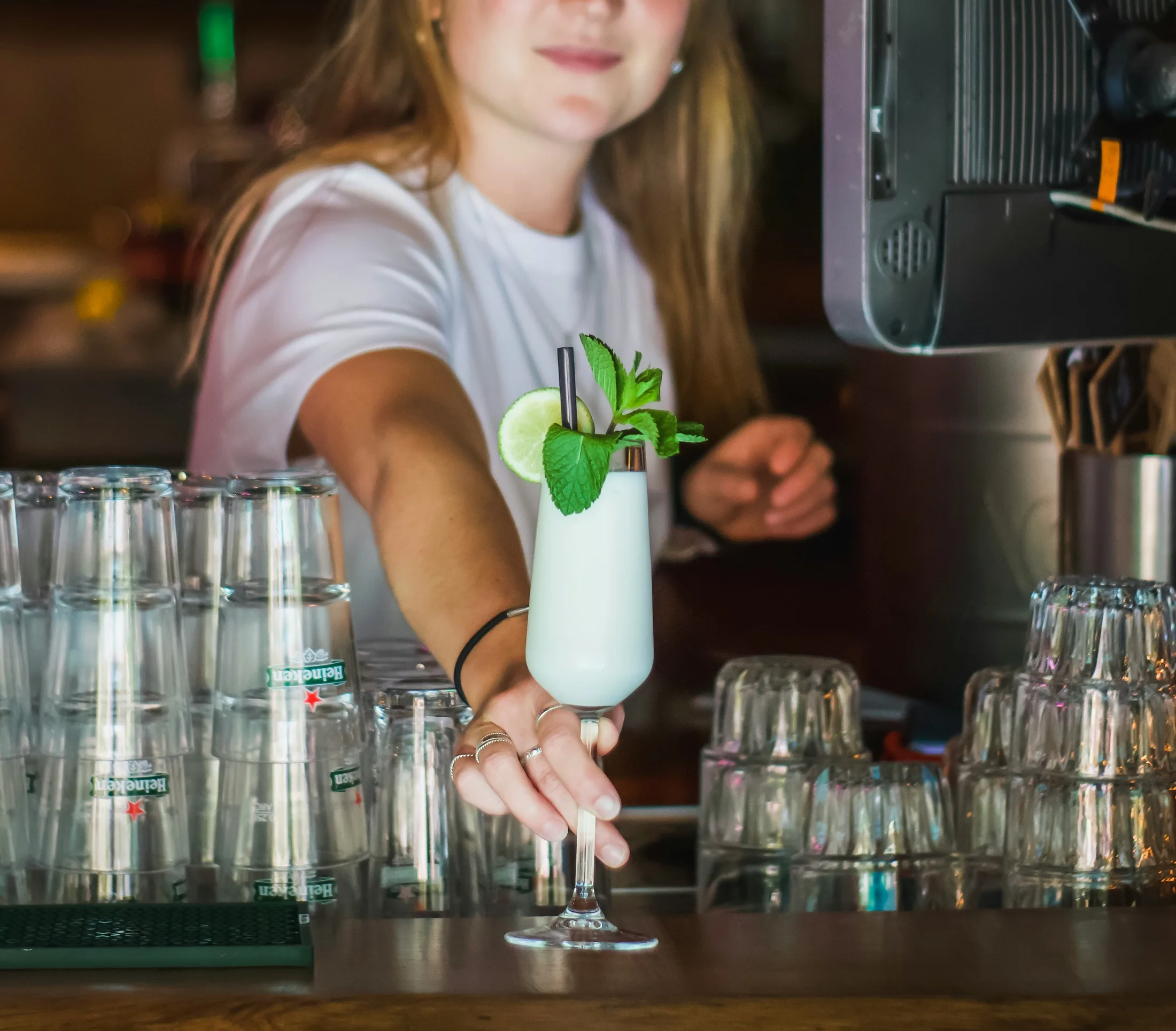 A bartender serving a drink